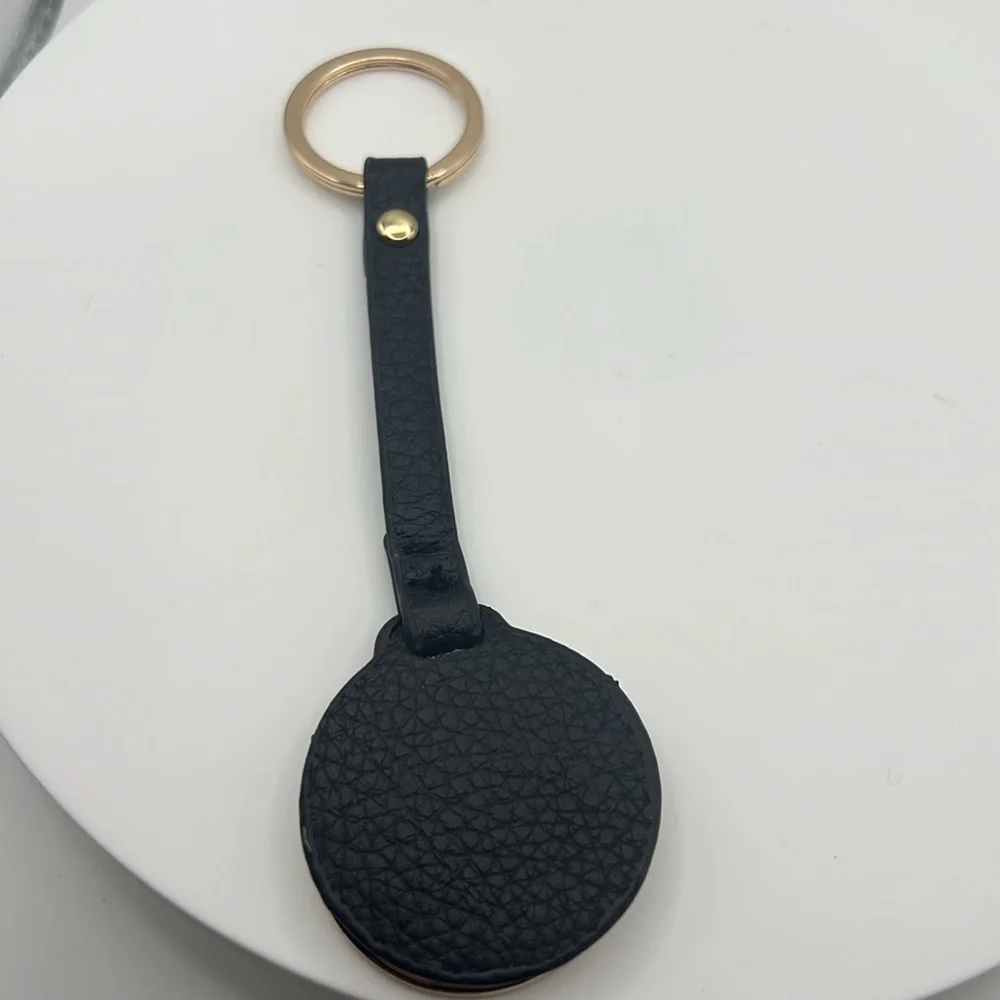858. Ellen Tracy Black and Gold Keychain